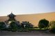 China: Temple next to the singing sand dunes of Mingsha Shan (Mingsha Hills) in the Kumtagh Desert, Gansu Province