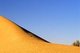 China: A microlight over the singing sand dunes of Mingsha Shan (Mingsha Hills) in the Kumtagh Desert, Gansu Province